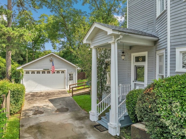 exterior space with a garage and an outdoor structure