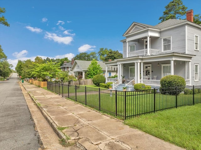 view of front facade with a porch and a front lawn