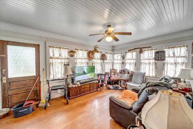 sunroom featuring ceiling fan