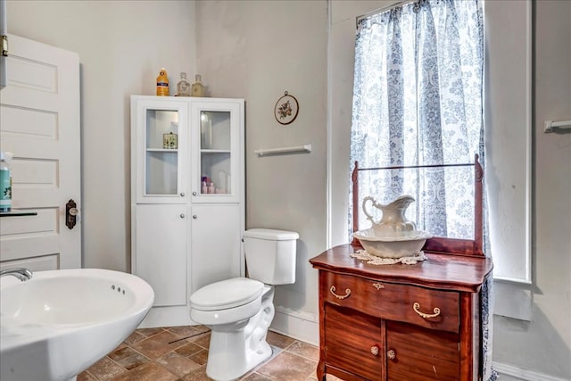 bathroom featuring sink and toilet