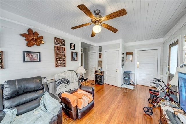 living room featuring wooden ceiling, light wood-type flooring, and ceiling fan