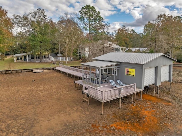 back of property featuring a deck