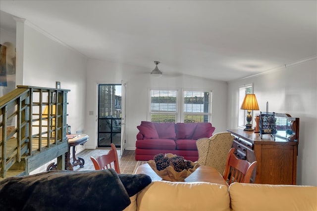 living room featuring ceiling fan, crown molding, light hardwood / wood-style floors, and lofted ceiling