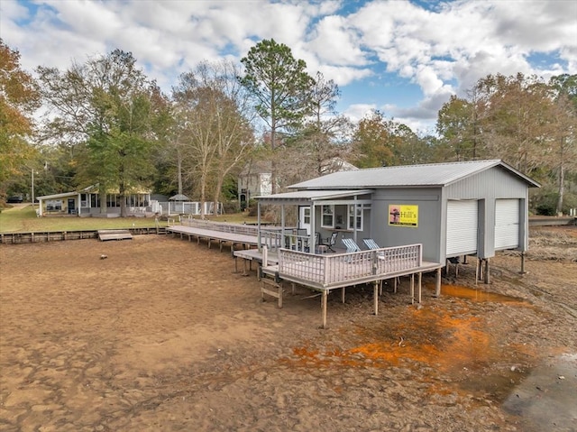 back of property featuring a wooden deck