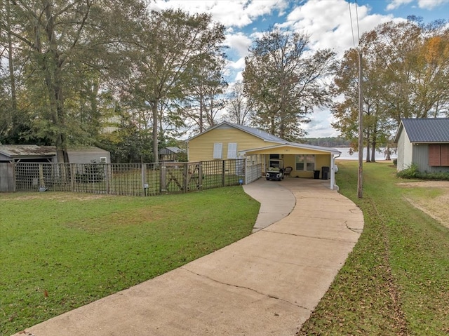 view of yard with a water view and a carport