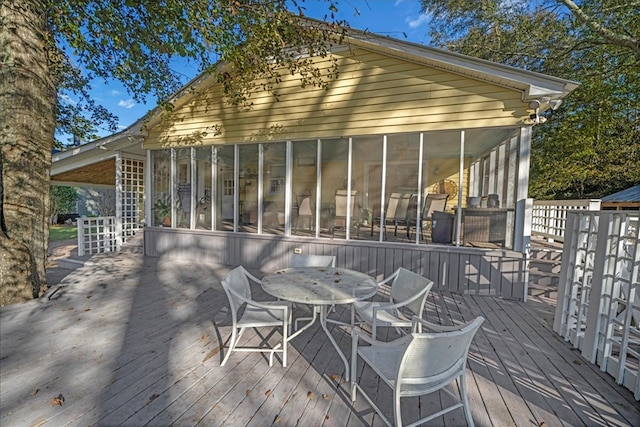 deck with a sunroom