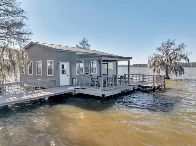 dock area with a deck with water view