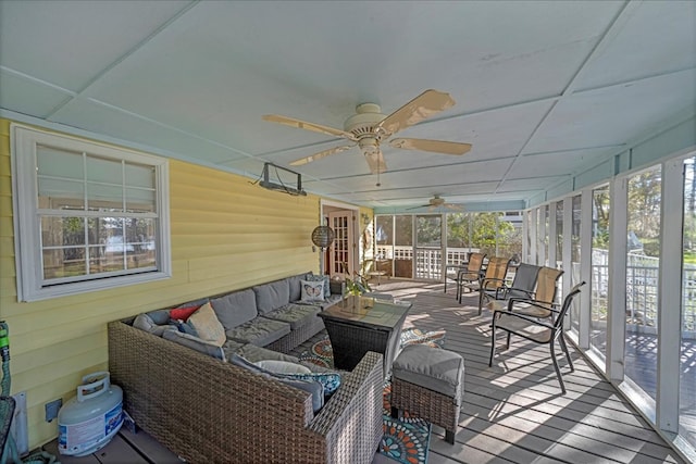 wooden deck with ceiling fan and an outdoor hangout area