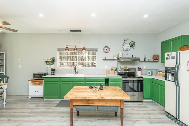 kitchen with green cabinetry, stainless steel range with electric stovetop, ceiling fan, white fridge with ice dispenser, and sink