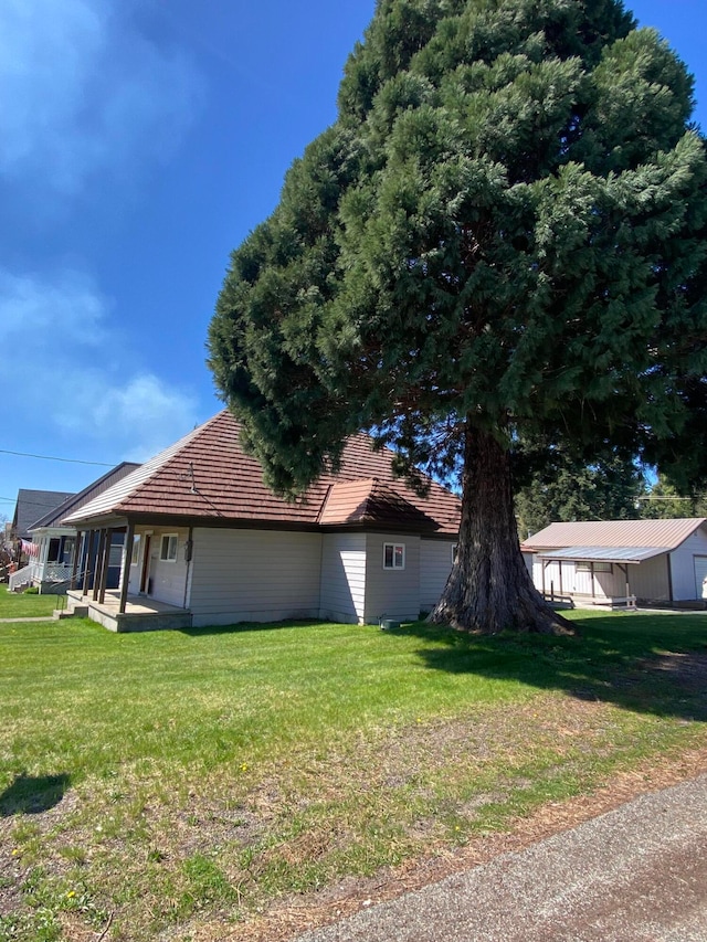 view of property exterior with a lawn