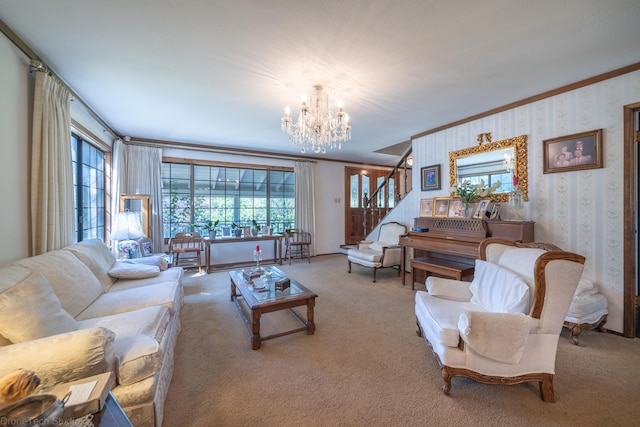 living room with a chandelier, carpet floors, and ornamental molding