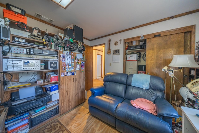 interior space with ornamental molding and light wood-type flooring