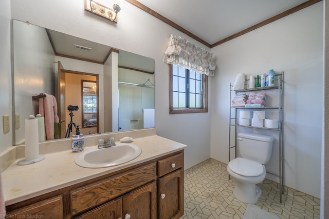 bathroom with oversized vanity, toilet, tile floors, and a healthy amount of sunlight