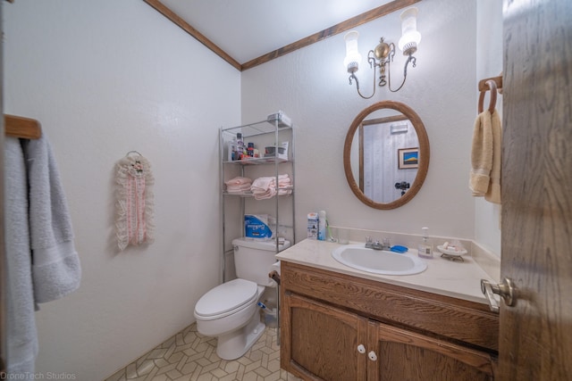 bathroom with toilet, ornamental molding, tile floors, vanity, and lofted ceiling