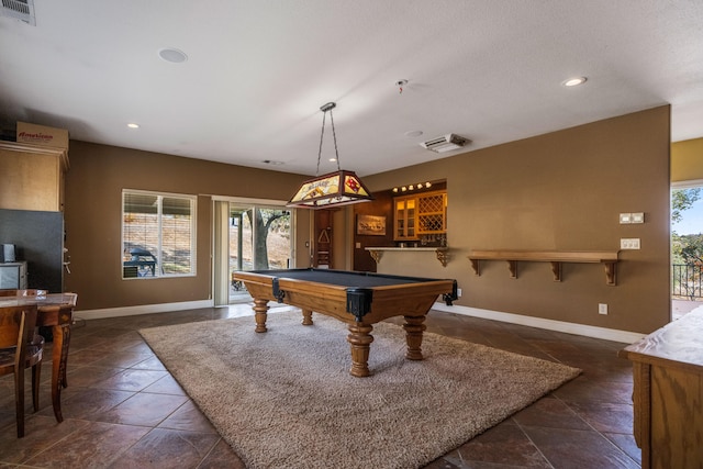 recreation room with indoor bar, pool table, and dark tile flooring