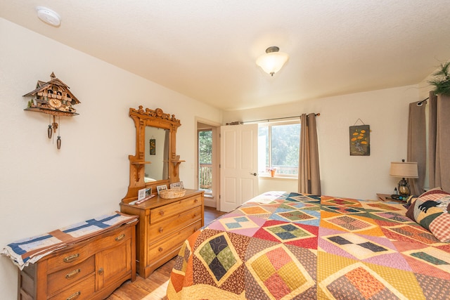 bedroom with light hardwood / wood-style floors