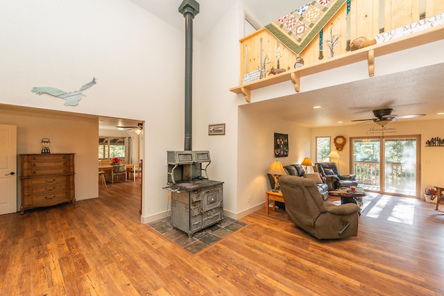 living room with hardwood / wood-style floors and a wood stove