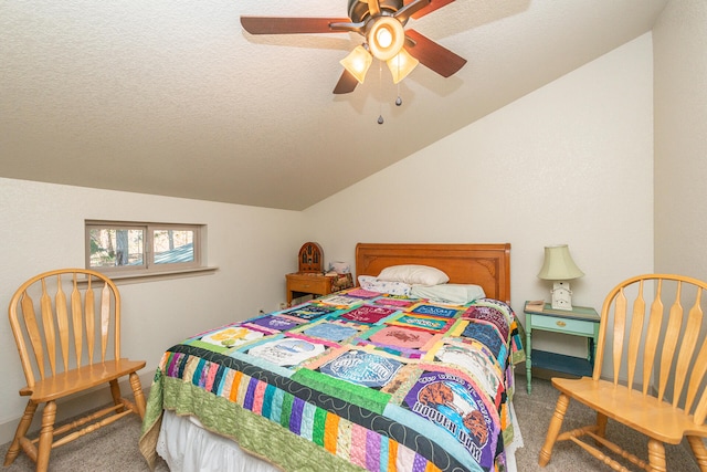 bedroom featuring vaulted ceiling, ceiling fan, a textured ceiling, and carpet flooring