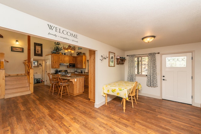 dining area with dark hardwood / wood-style flooring