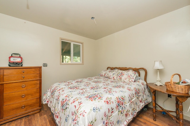 bedroom featuring dark hardwood / wood-style flooring