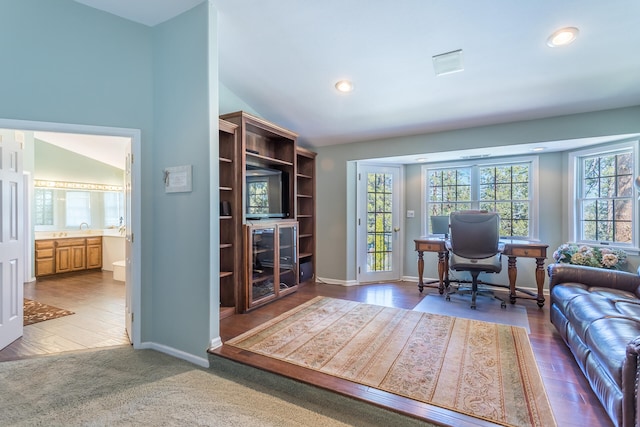 office area with lofted ceiling and light wood-type flooring