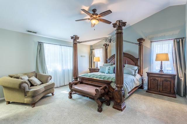 bedroom featuring light carpet, vaulted ceiling, and ceiling fan