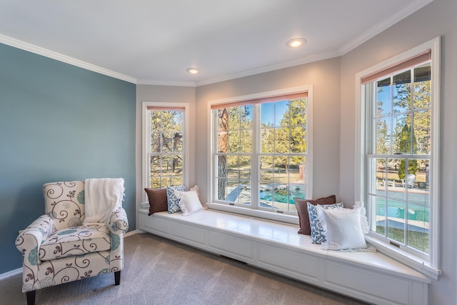 sitting room featuring light carpet and crown molding