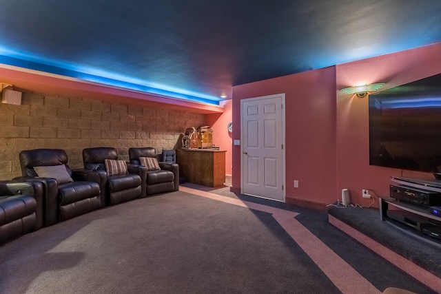 cinema room featuring carpet flooring