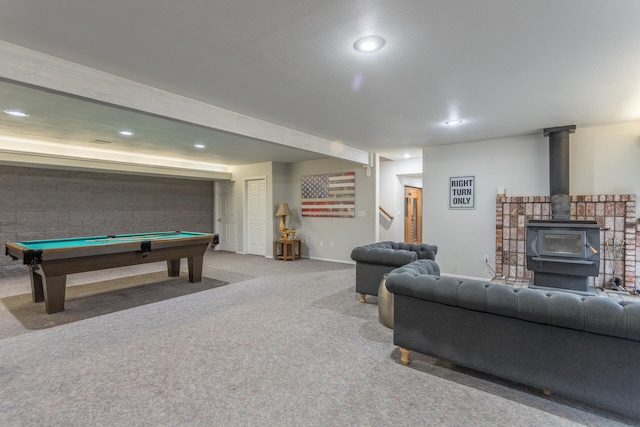 interior space with light carpet, billiards, and a wood stove