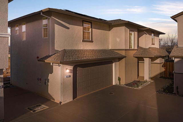 view of front of property with a garage