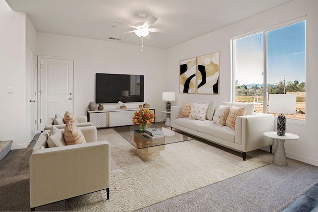 carpeted living room with ceiling fan