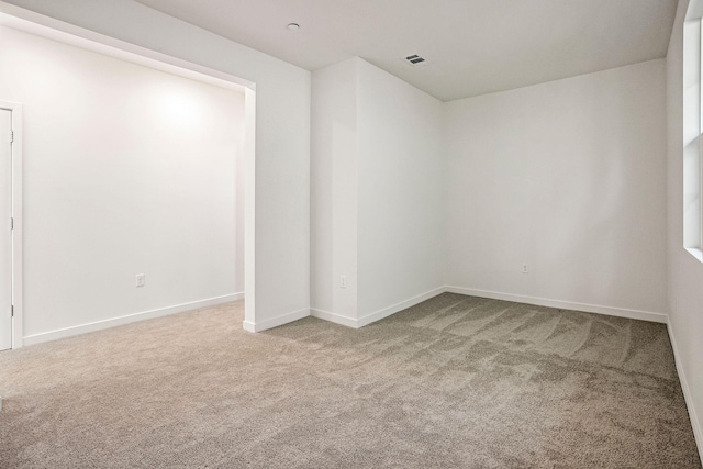 unfurnished room featuring carpet