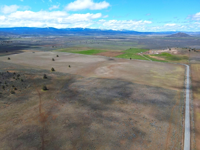 aerial view with a mountain view and a rural view