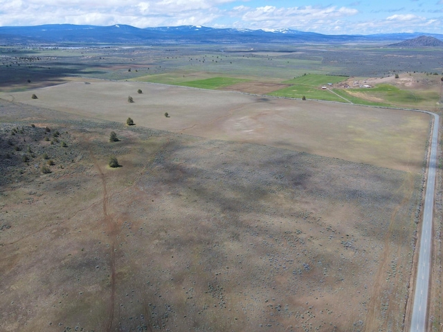 birds eye view of property featuring a rural view and a mountain view