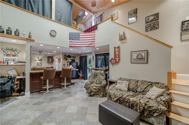 living room featuring indoor bar, high vaulted ceiling, ceiling fan, and light tile floors