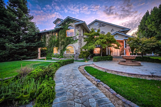 view of front of house with a lawn