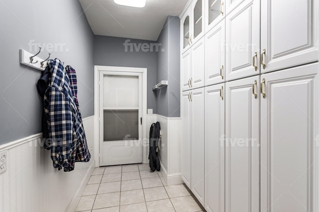 mudroom with light tile flooring