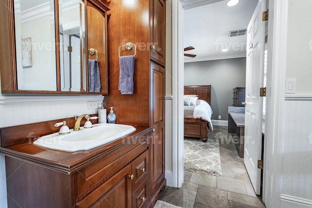 bathroom featuring tile floors, ceiling fan, vanity, and crown molding