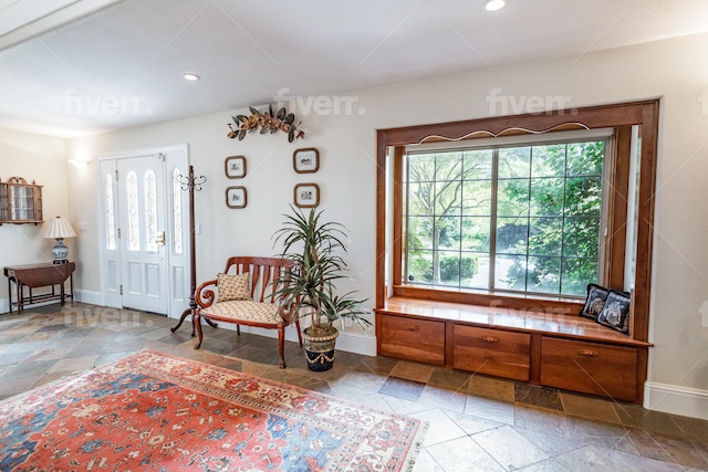 sitting room with plenty of natural light and tile floors