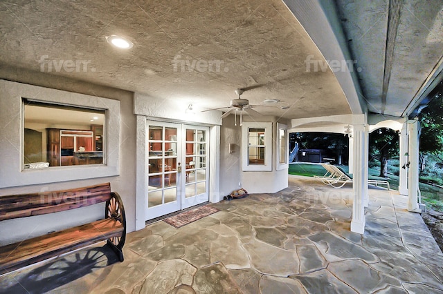 view of patio featuring french doors and ceiling fan