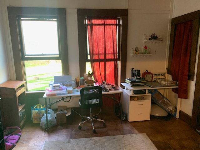 tiled office space with a healthy amount of sunlight