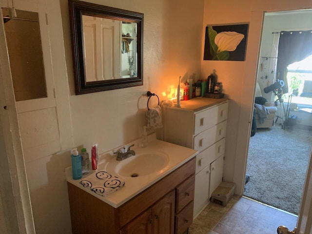 bathroom with large vanity and tile floors