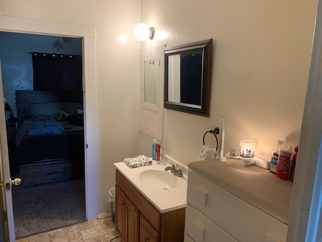 bathroom with large vanity and tile floors