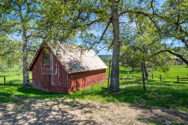 view of outdoor structure featuring a rural view