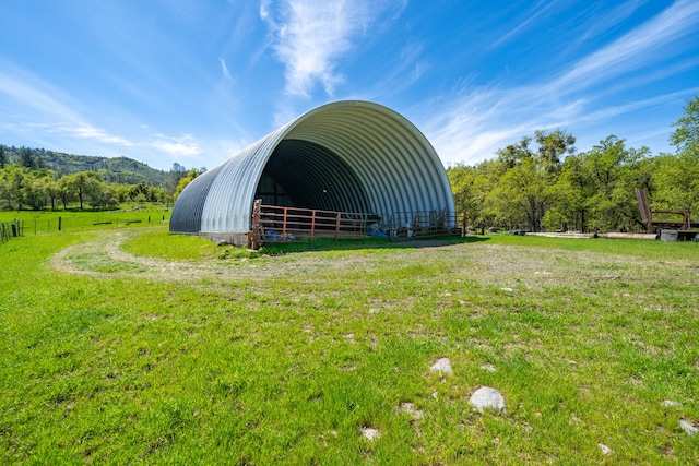 exterior space with a yard and an outdoor structure