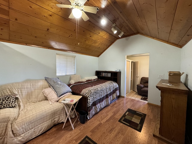 bedroom featuring ceiling fan, vaulted ceiling, wood ceiling, and wood-type flooring