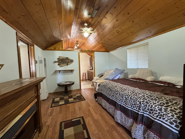 bedroom featuring wooden ceiling, wood-type flooring, and vaulted ceiling