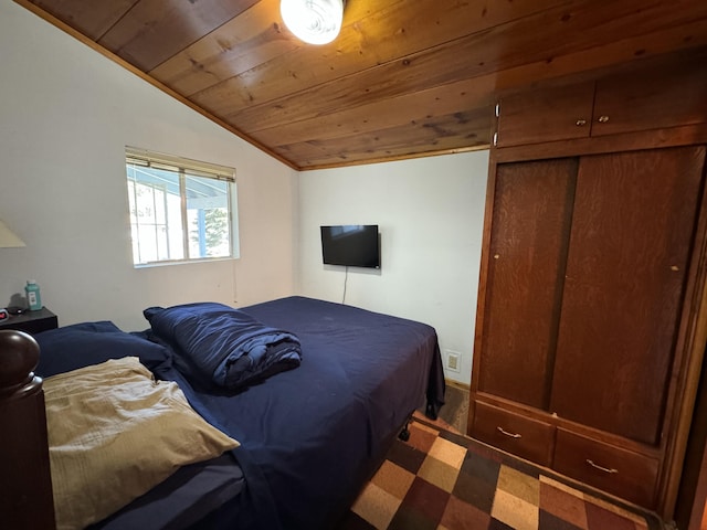 bedroom with wood ceiling and vaulted ceiling