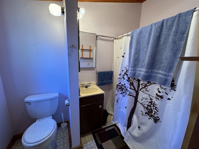 bathroom featuring vanity, toilet, and tile floors