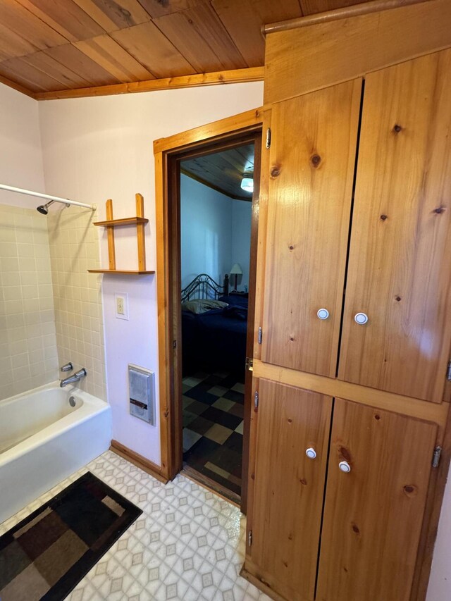 bathroom featuring tile floors, tiled shower / bath, and wooden ceiling